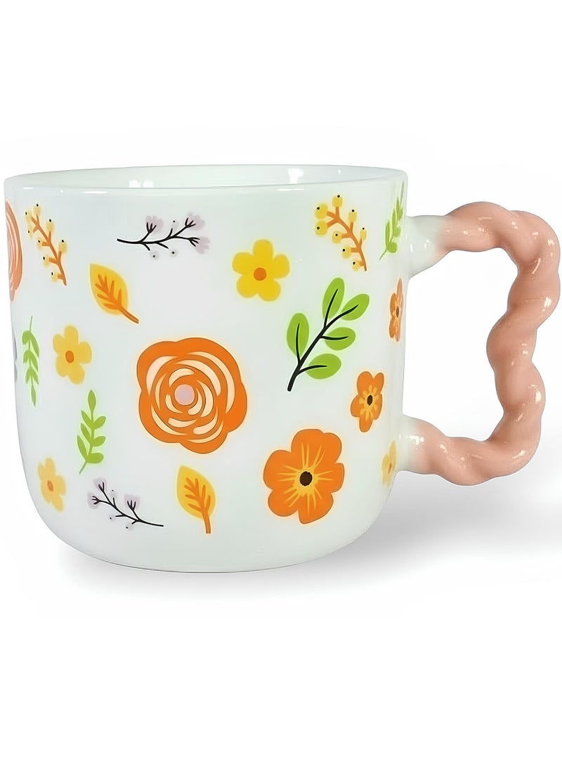 مج بورسيلين راقي سعة 380 ملي بنقوش أزهار ربيعية مبهجة وألوان برتقالية وصفراء زاهية مع يد وردية بتصميم مضلع مريح لليد - Image 1